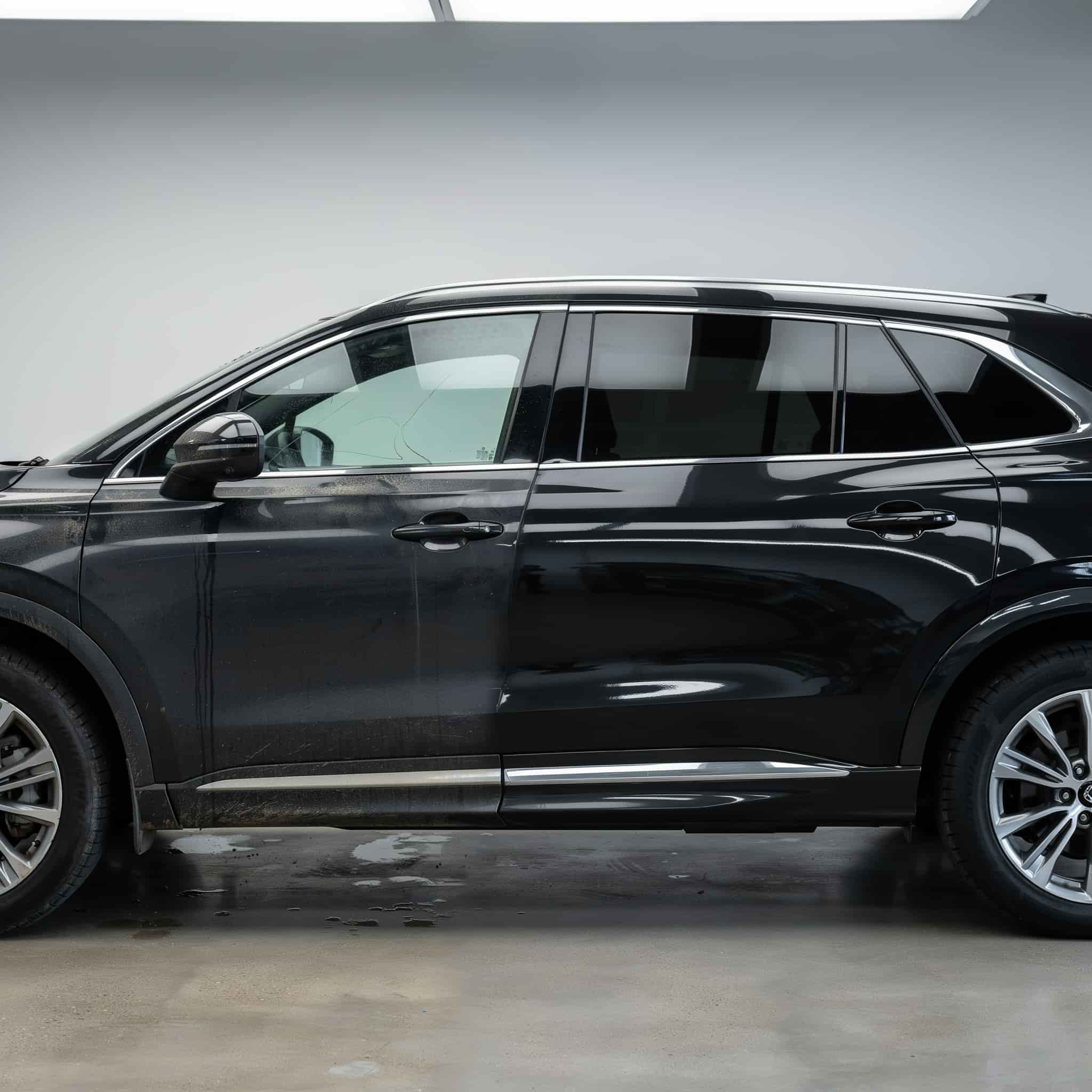 Black SUV showcase after premium exterior detailing showing glossy paint finish